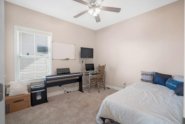 bedroom with carpet flooring, a ceiling fan, and baseboards