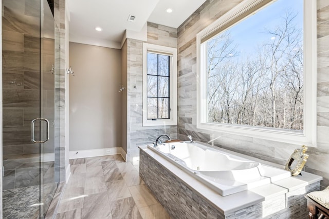 bathroom with recessed lighting, visible vents, baseboards, a stall shower, and tiled tub