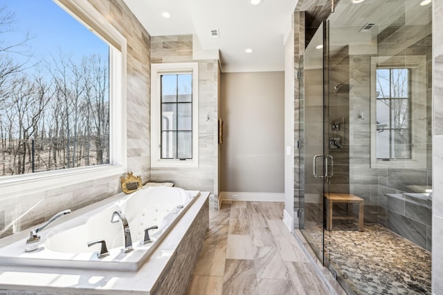 full bathroom with a stall shower, visible vents, baseboards, a tub with jets, and recessed lighting