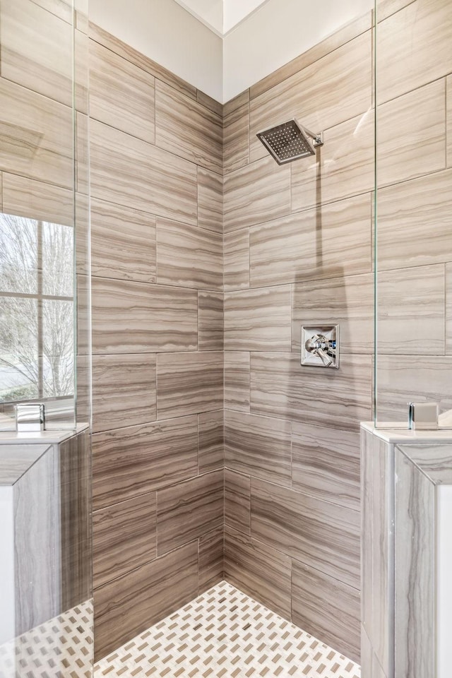 bathroom with a tile shower