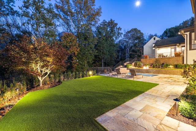 view of yard with a patio area, a fenced backyard, and a fenced in pool