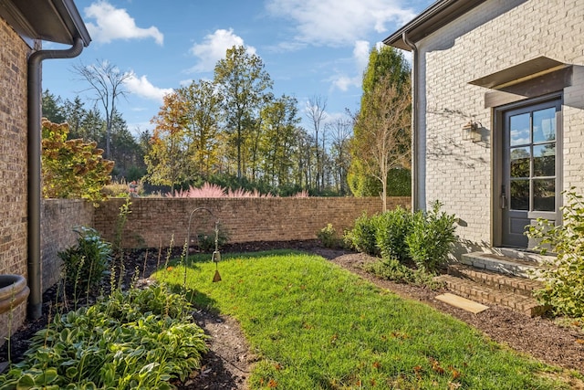 view of yard with a fenced backyard