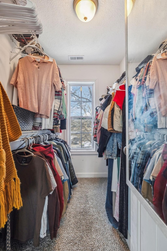 walk in closet with carpet and visible vents