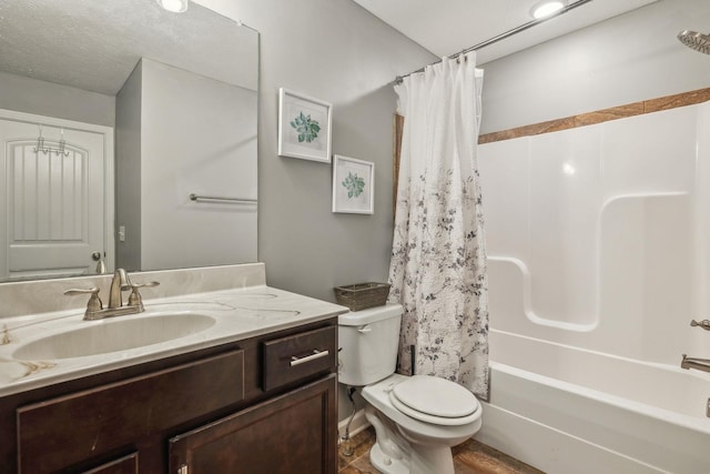 bathroom featuring shower / bath combo, vanity, and toilet