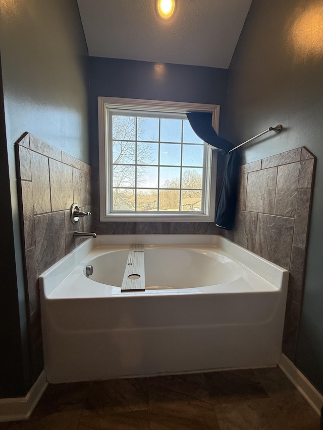 bathroom featuring a garden tub