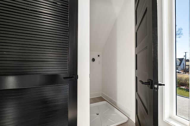 bathroom with baseboards and wood finished floors