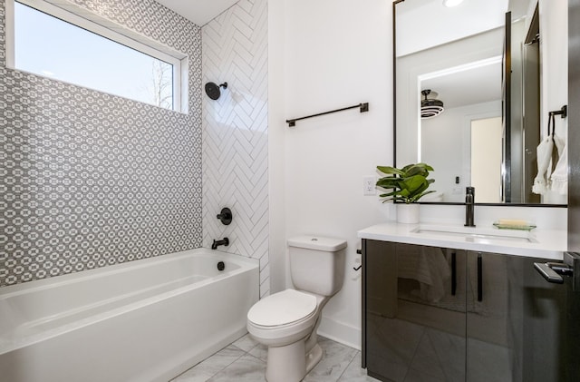 full bath featuring toilet, marble finish floor, bathtub / shower combination, and vanity
