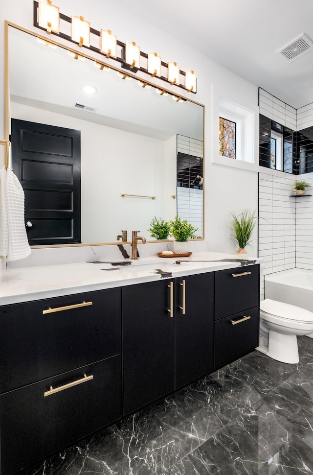 bathroom with toilet, marble finish floor, visible vents, and vanity