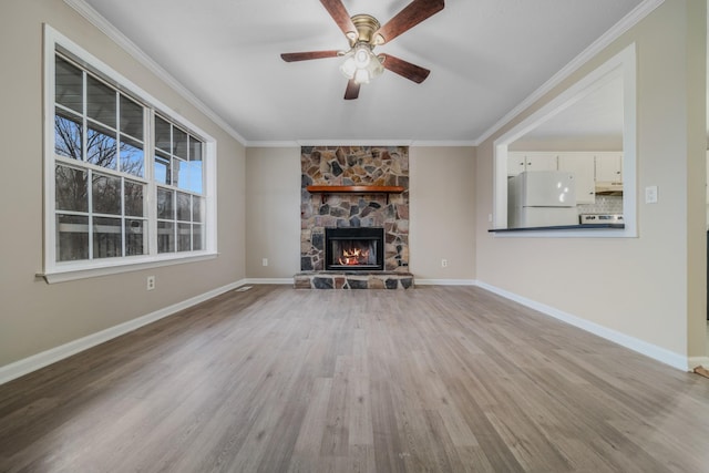 unfurnished living room featuring light wood finished floors and ornamental molding