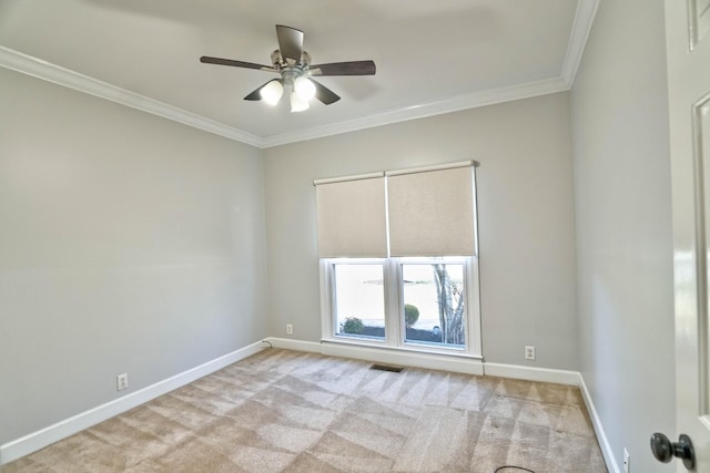 spare room featuring crown molding, light carpet, visible vents, and baseboards