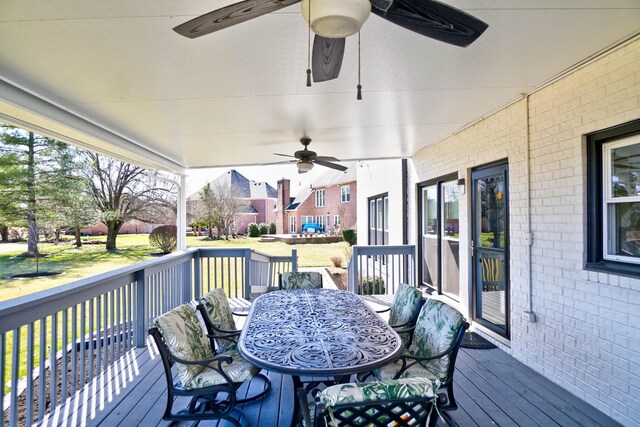 deck with ceiling fan and outdoor dining space