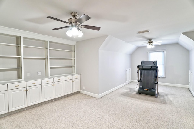 workout room with lofted ceiling, light colored carpet, visible vents, ceiling fan, and baseboards