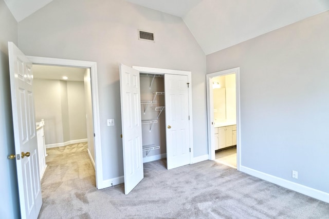 unfurnished bedroom with light carpet, a closet, visible vents, and baseboards