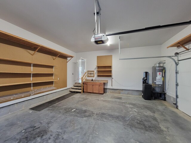 garage featuring water heater and a garage door opener