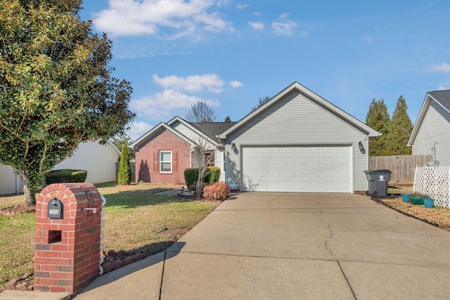 ranch-style home with a garage, a front yard, fence, and driveway