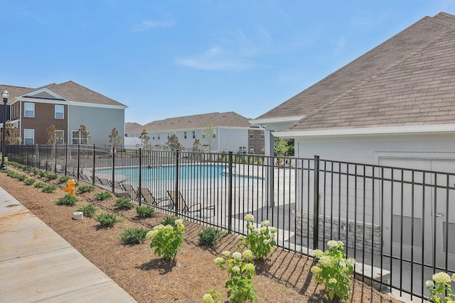 pool featuring a residential view and fence