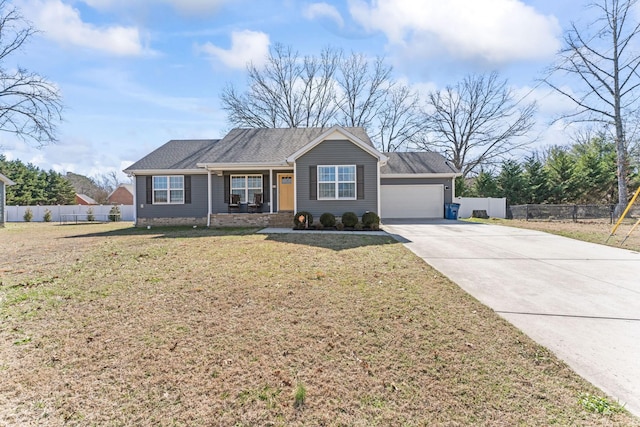 single story home with a front yard, fence, driveway, and an attached garage