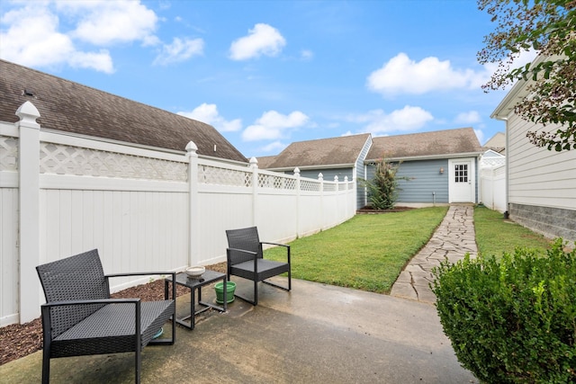 view of patio / terrace featuring a fenced backyard and an outdoor structure