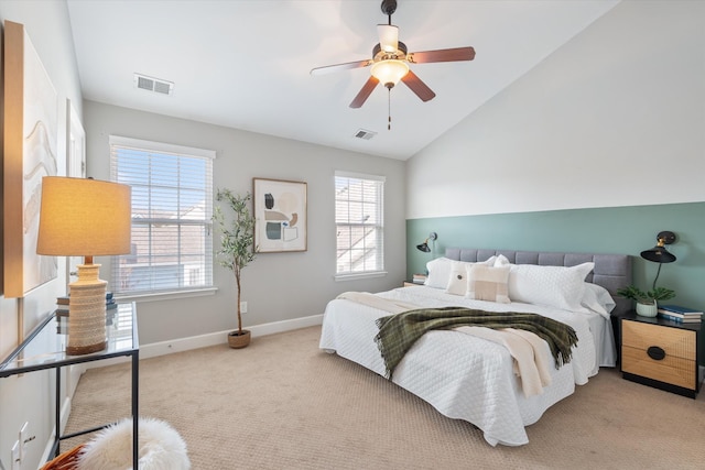 bedroom featuring light colored carpet, visible vents, vaulted ceiling, and baseboards