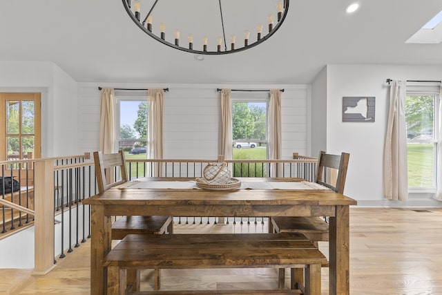 dining room featuring a healthy amount of sunlight and light wood-style floors