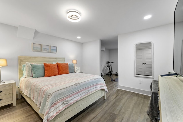 bedroom featuring recessed lighting, dark wood finished floors, and baseboards