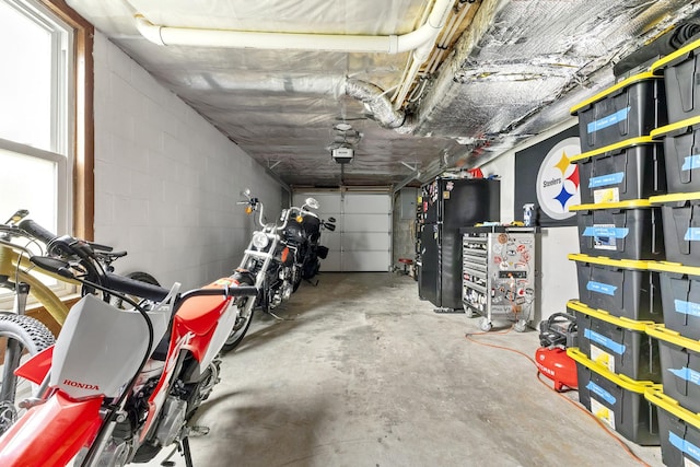 garage with concrete block wall