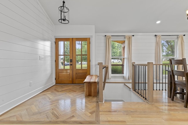 entryway featuring lofted ceiling, french doors, a healthy amount of sunlight, and recessed lighting