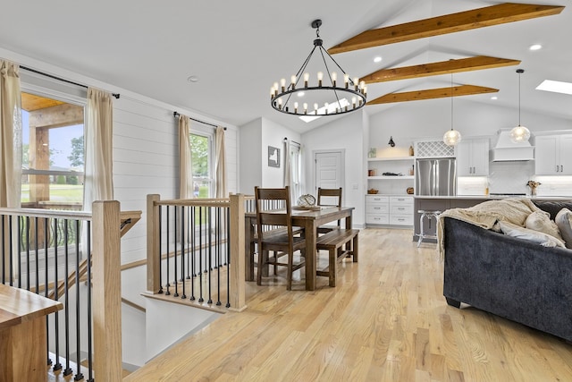 dining room featuring light wood-style floors, recessed lighting, and lofted ceiling with beams