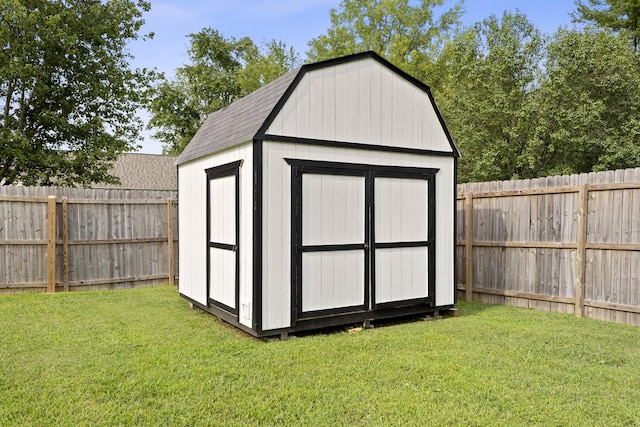 view of shed with a fenced backyard