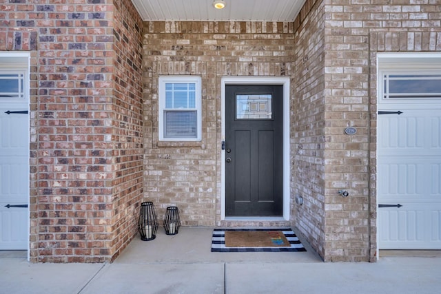 property entrance with brick siding