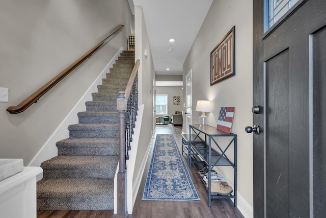 entrance foyer featuring recessed lighting, stairway, baseboards, and wood finished floors