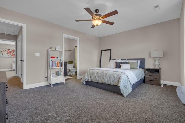 carpeted bedroom featuring attic access, visible vents, baseboards, a ceiling fan, and ensuite bathroom