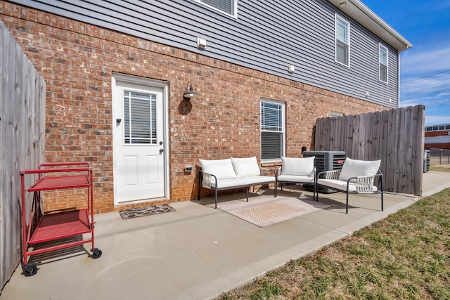 view of patio / terrace with fence and an outdoor living space