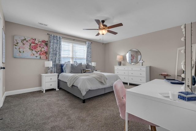 carpeted bedroom featuring ceiling fan, visible vents, and baseboards