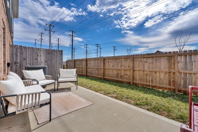 view of patio with outdoor lounge area and fence