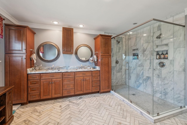 full bathroom featuring ornamental molding, a stall shower, and a sink