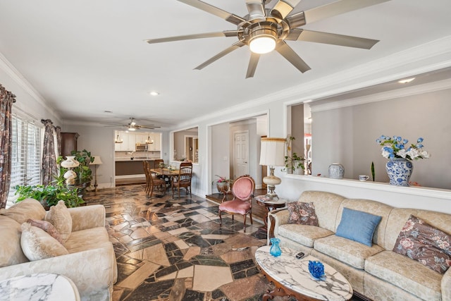 living area with a ceiling fan, crown molding, and baseboards