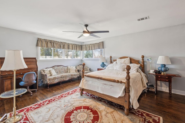 bedroom featuring dark wood-style floors, visible vents, ceiling fan, and baseboards