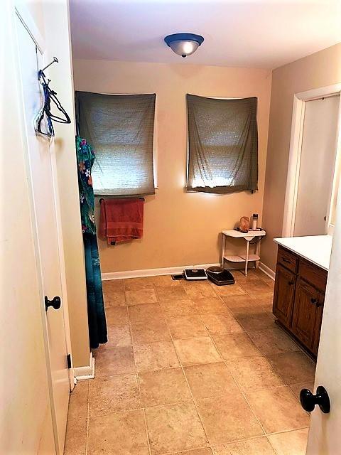 bathroom with baseboards and vanity