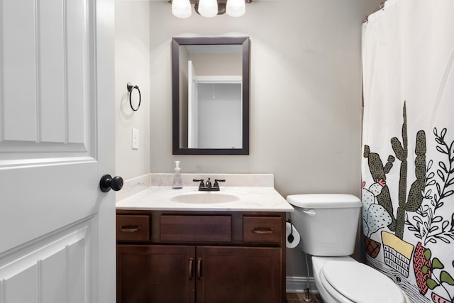 full bath featuring toilet and vanity