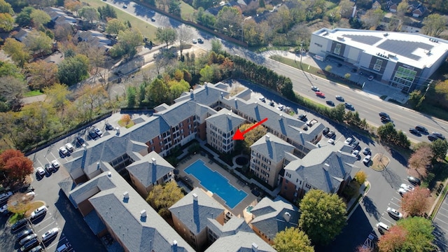 birds eye view of property with a residential view