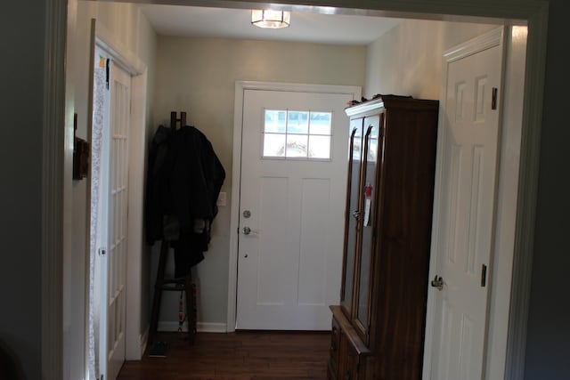 doorway to outside with dark wood-style flooring