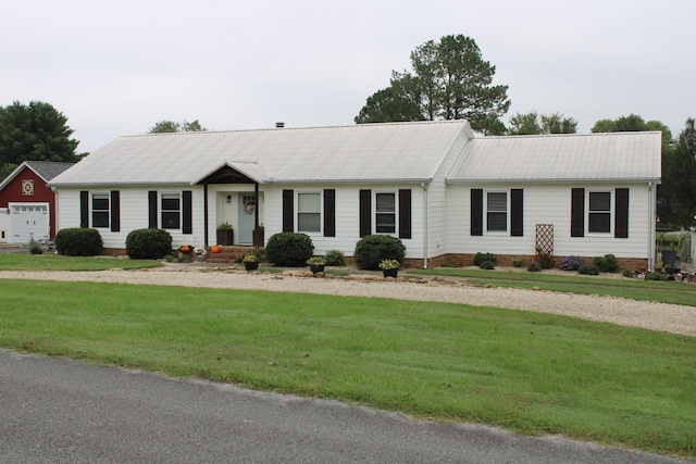 ranch-style house with a garage, a front yard, crawl space, and metal roof