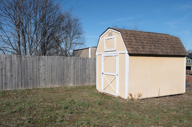 view of shed with fence