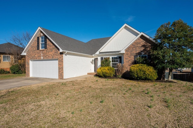 view of front of house featuring driveway, brick siding, and a front yard