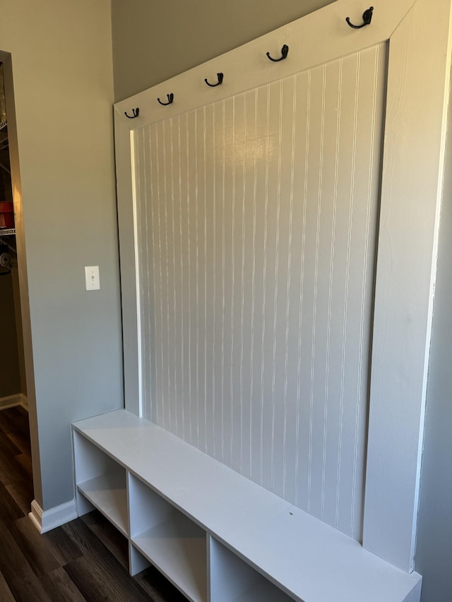 mudroom with dark wood-style floors