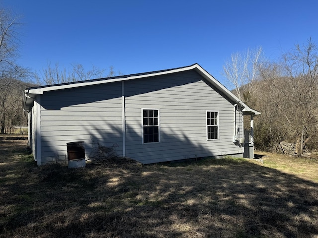 view of home's exterior with a lawn