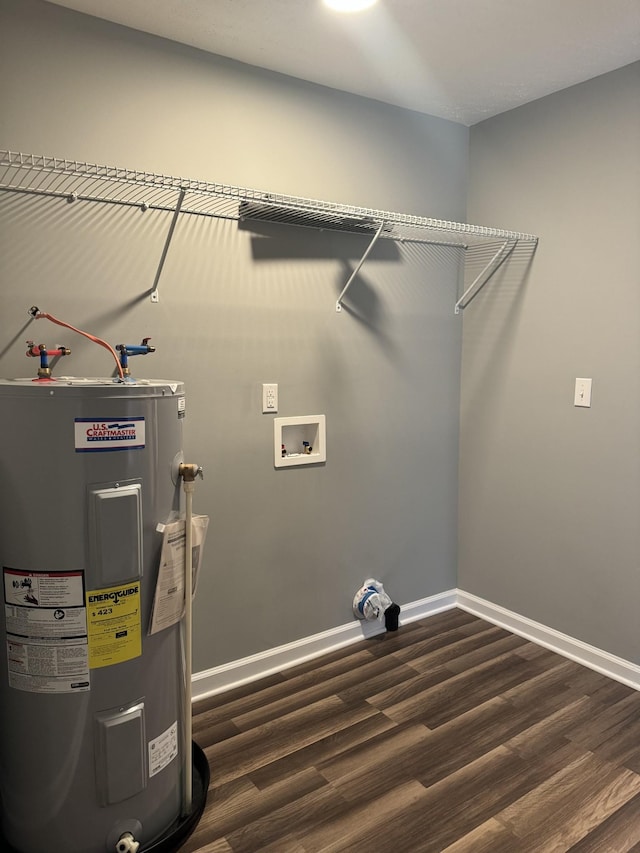 laundry room with baseboards, water heater, laundry area, hookup for a washing machine, and dark wood-style flooring