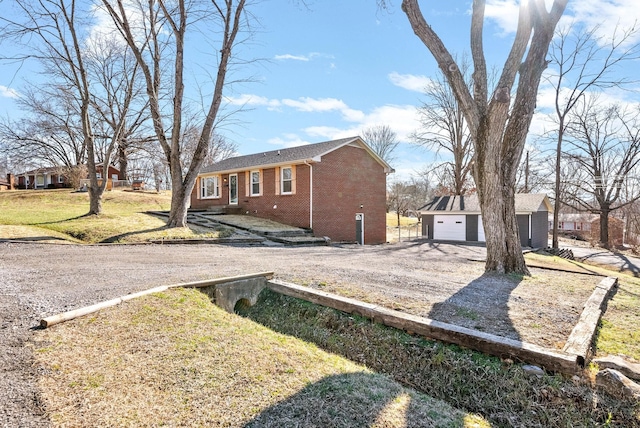 view of side of property featuring a lawn and brick siding