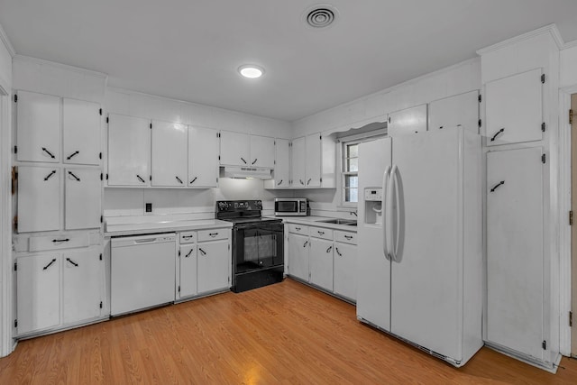 kitchen with light countertops, white cabinetry, a sink, white appliances, and under cabinet range hood